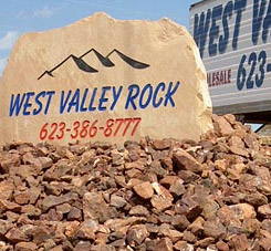 West Valley Rock sign on top of stones