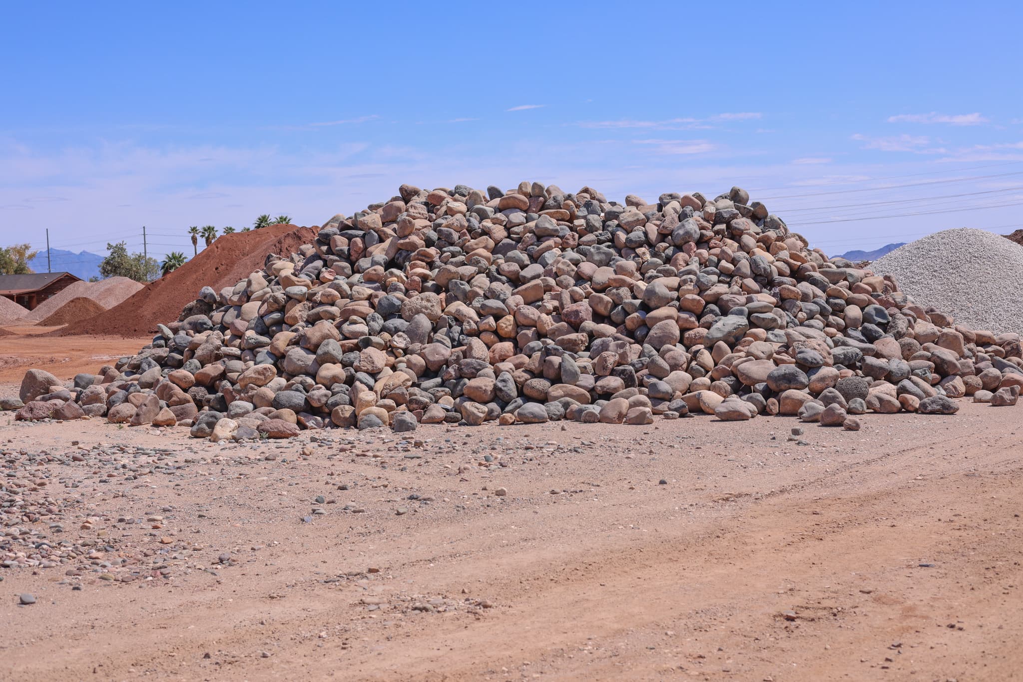 River Rock: Dark, stream-sourced rock ideal for landscaping.