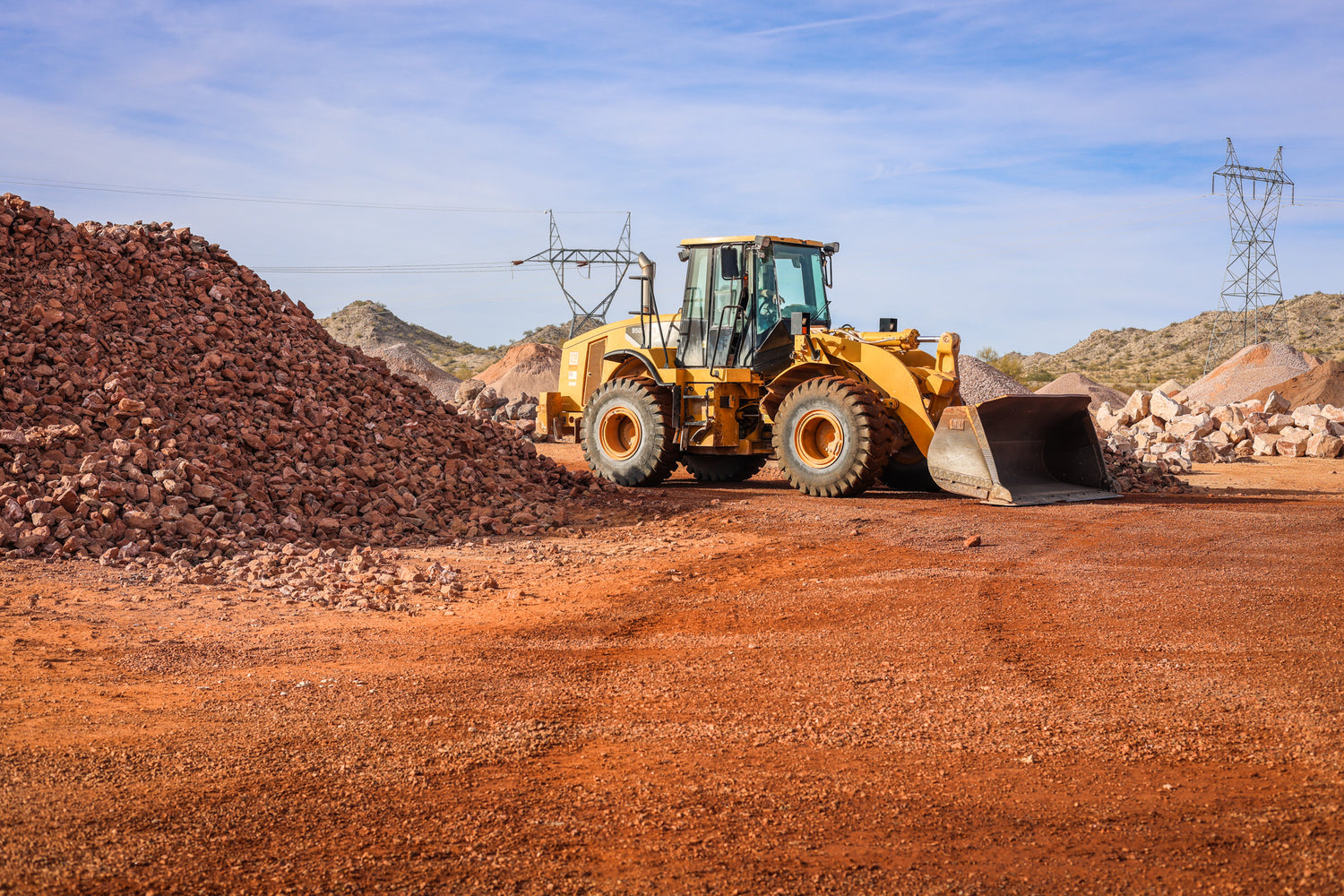 Vehicle gathering the crushed rocks for transport